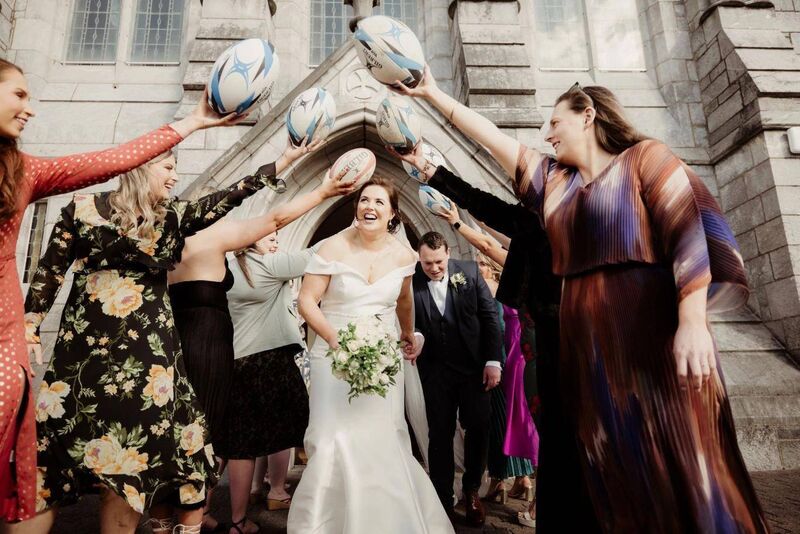 Some of Róisín’s teammates from Ballincollig RFC performed a guard of honour outside the church. The couple continued the wedding celebrations the next day at the Rugby Club in Ballincollig, where they watched a 6 Nations games, the band These Charming Men played, and they partied the night away. Some of Róisín’s teammates from Ballincollig RFC performed a guard of honour outside the church. The couple continued the wedding celebrations the next day at the Rugby Club in Ballincollig, where they watched a 6 Nations games, the band These Charming Men played, and they partied the night away.
