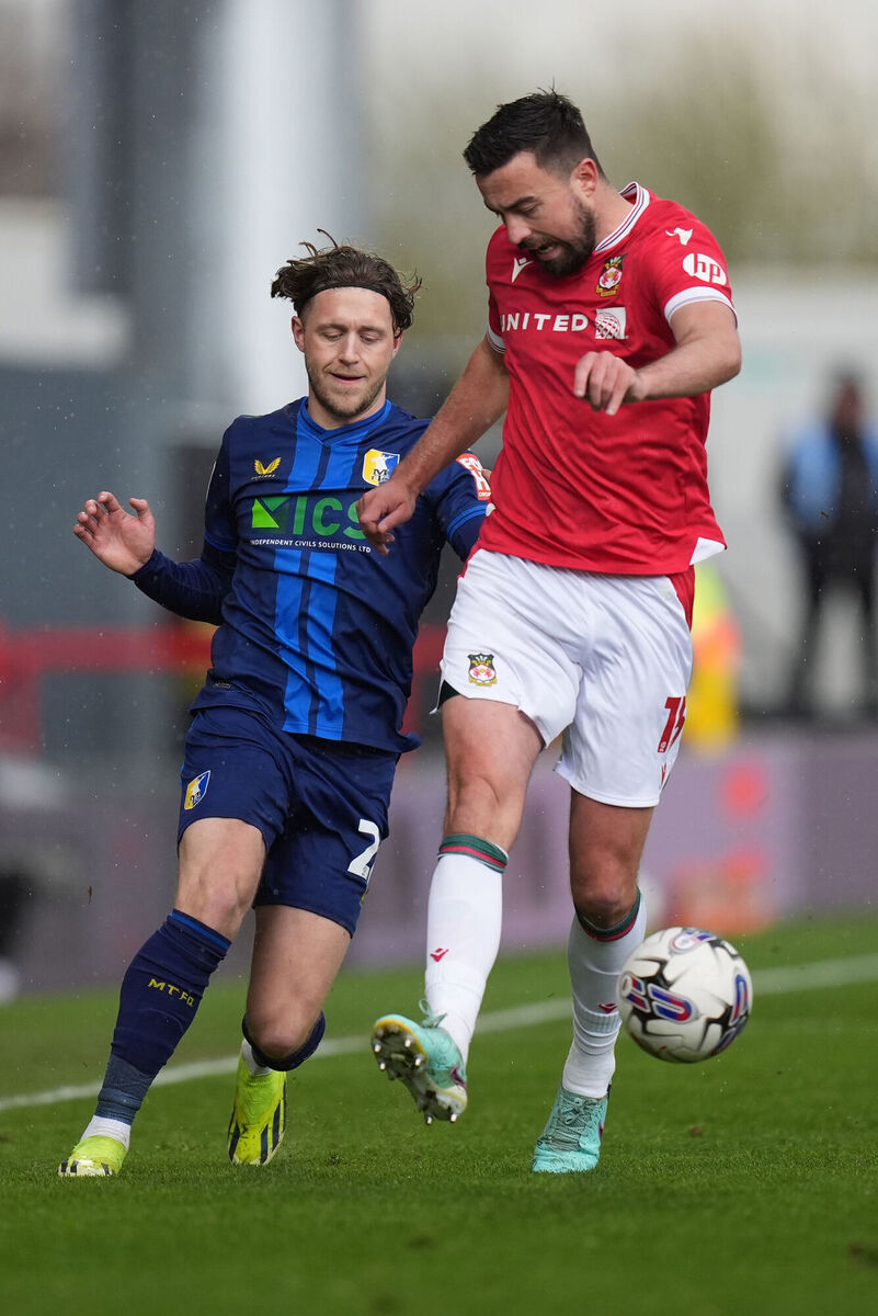 Wrexham’s Eoghan O'Connell (right) and Mansfield Town's Will Swan in action. Picture: Jacob King/PA Wire.