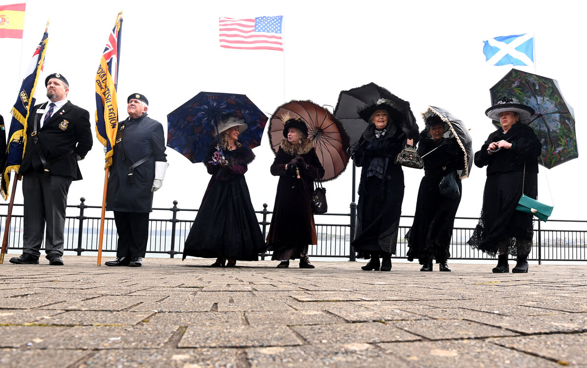  Members of Cobh Animation Team hold on to their umbrellas in the strong winds at the promenade.Pic Larry Cummins