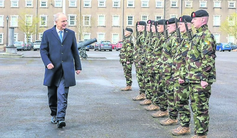 Tánaiste Micheál Martin inspecting a guard of honour at the accommodation block.	Picture: David Creedon
