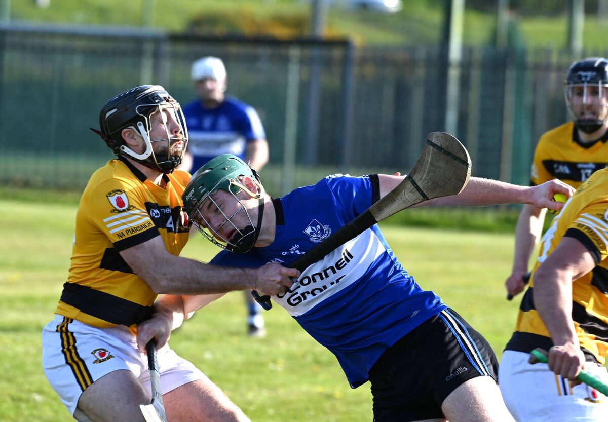 Kevin Crowley with possession for Sars as he struggles to get past Keith Buckley, Na Piarsaigh, in the RedFM Senior Hurling League game. Picture: Larry Cummins