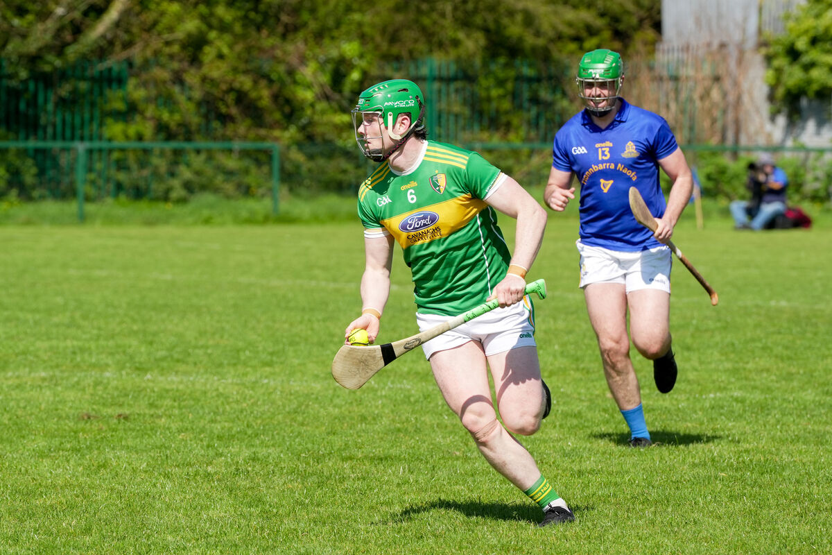 Newtown's Cormac O'Brien drives the slioatar up-field against St Finbarr's. Newtown's Cormac O'Brien drives the slioatar up-field against St Finbarr's.