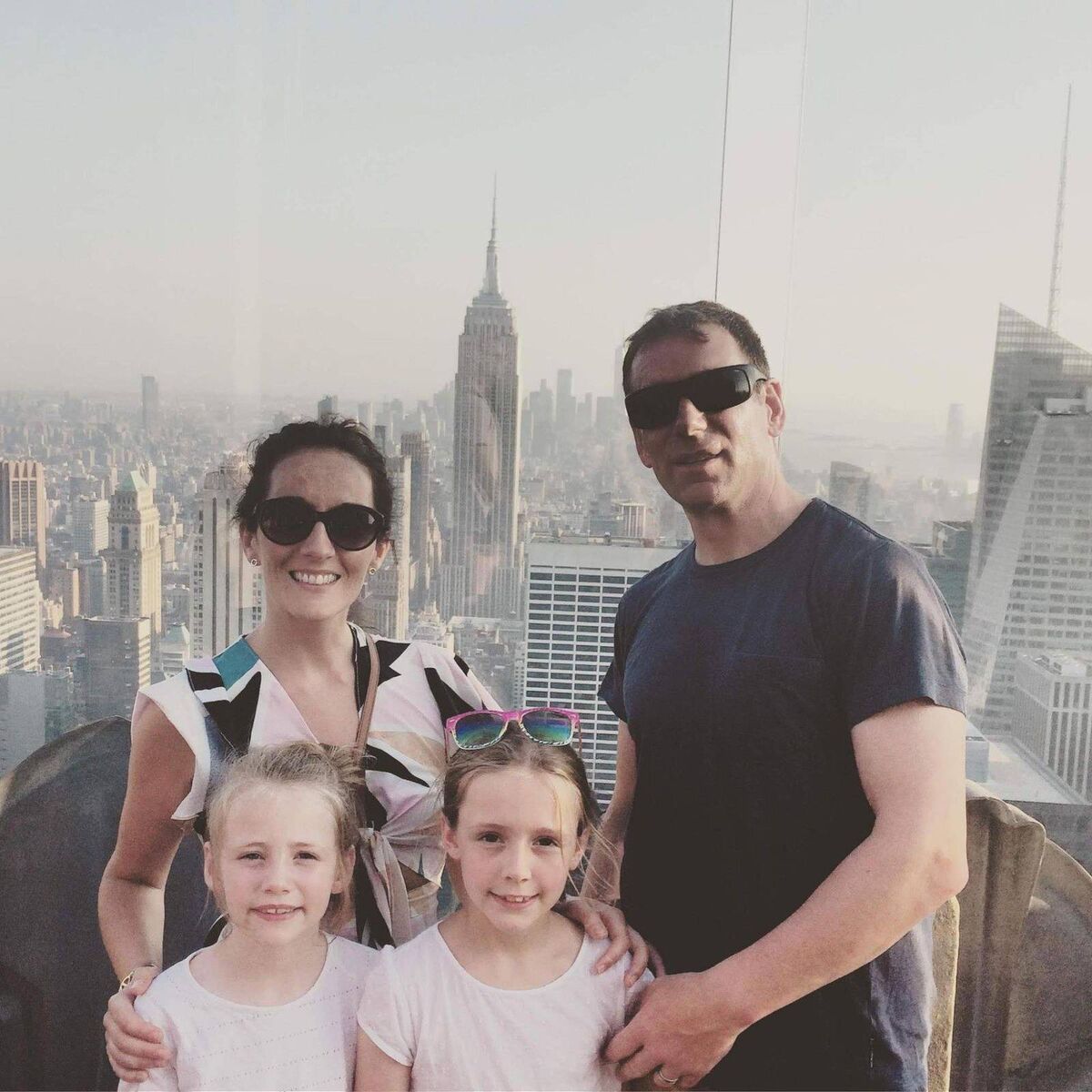 Sharon Holland , husband Jer and their daughters Miah and Faye.