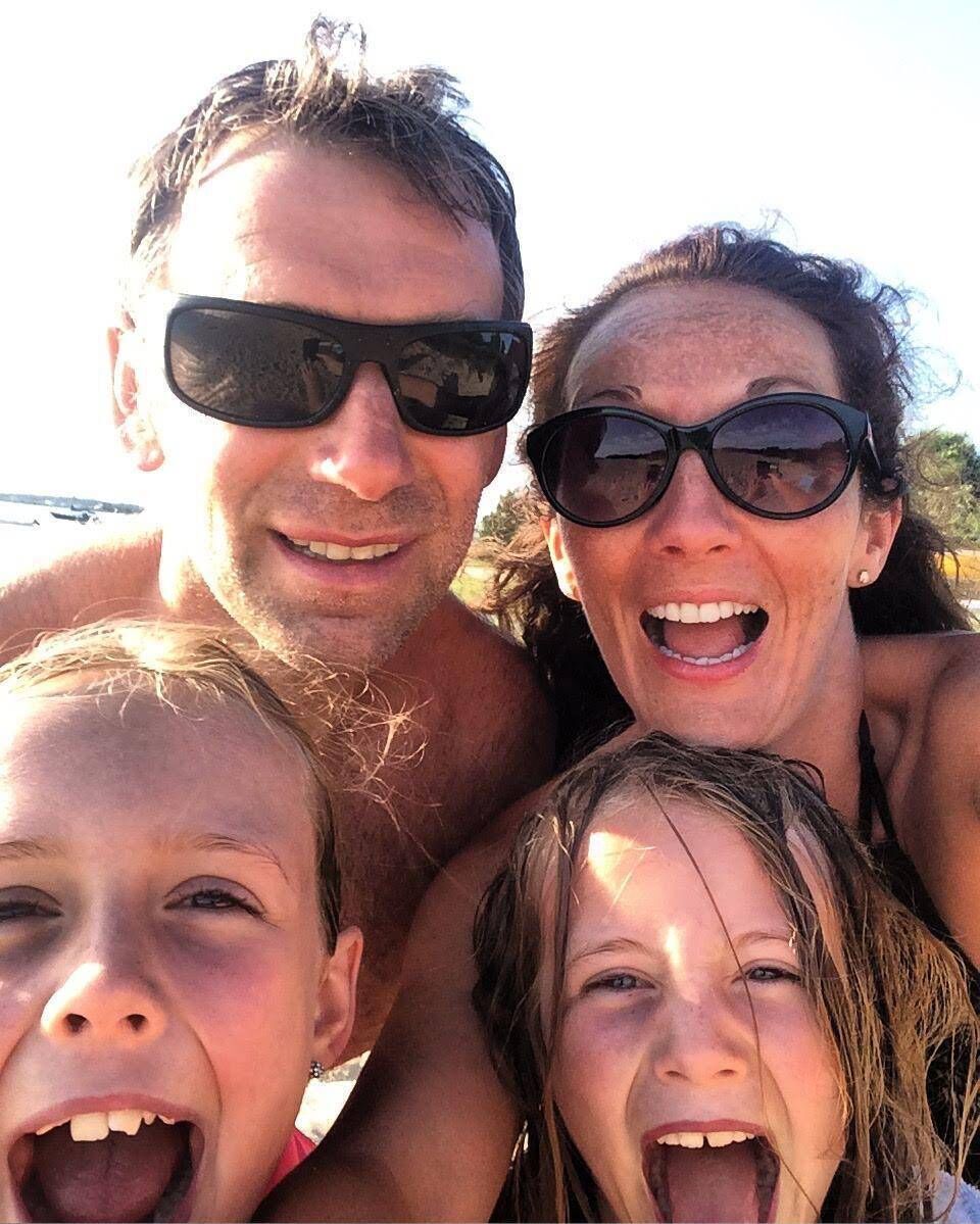 Sharon Holland , husband Jer and their daughters Miah and Faye.
