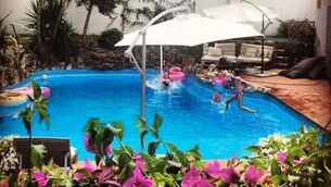 <p>The family enjoying a holiday abroad. They have done 50 home exchanges.</p>