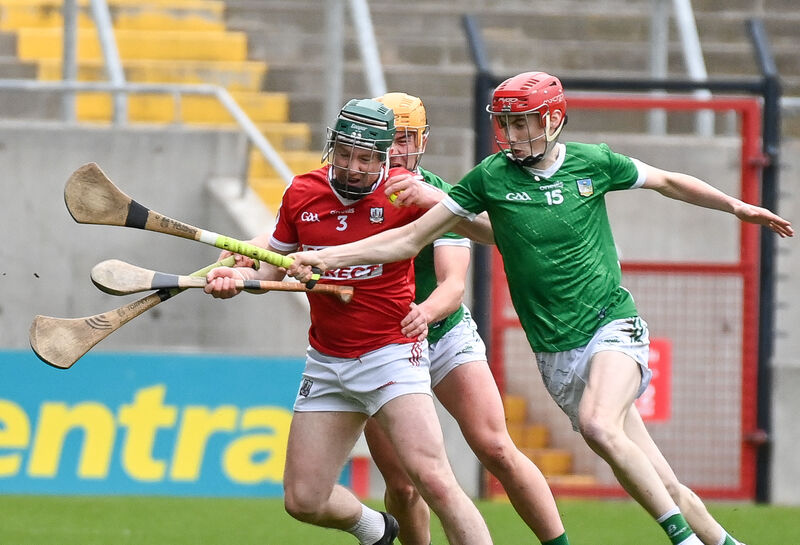 Cork's Kevin Lyons keeps possession under pressure from Limerick's Hugh Flanagan and Oisin O'Farrell. Picture: David Keane. Cork's Kevin Lyons keeps possession under pressure from Limerick's Hugh Flanagan and Oisin O'Farrell. Picture: David Keane.