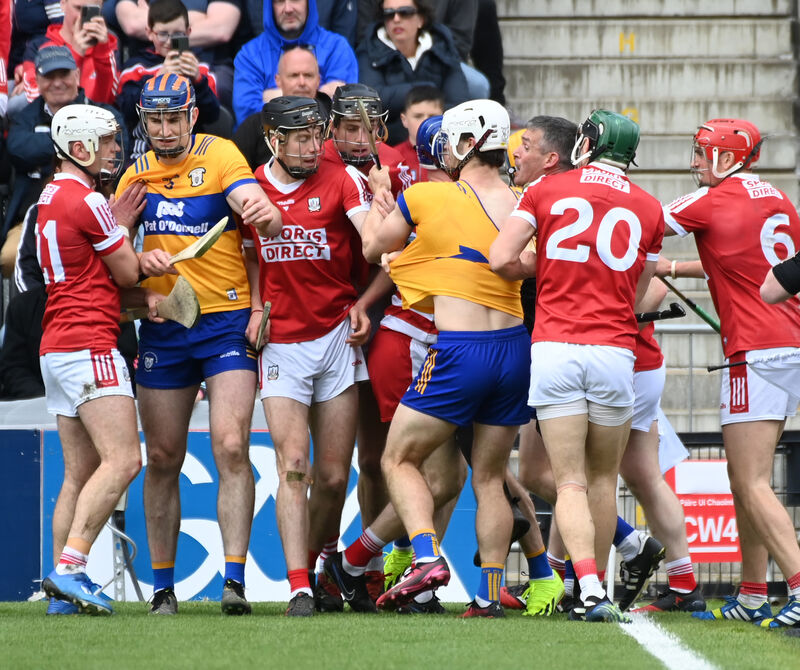 Referee James Owens gets in between Cork and Clare players. Picture: Eddie O'Hare Referee James Owens gets in between Cork and Clare players. Picture: Eddie O'Hare