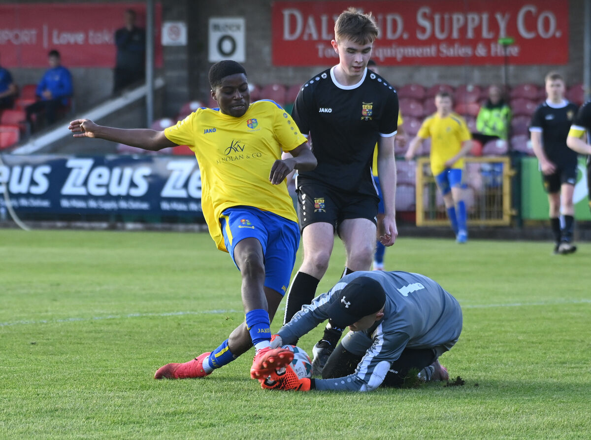 College Corinthians goalkeeper Raymond Foley Kiss saves at the feet of Carrigaline United's Timmy Best Alade during the Jako Ireland Munster youth cup final at Turner's Cross. Picture: Eddie O'Hare