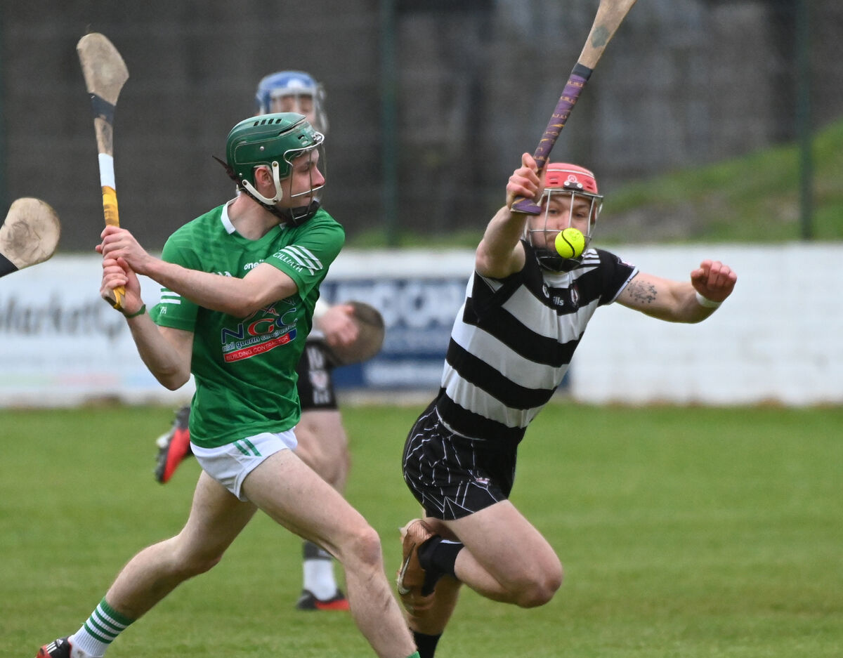 Killeagh's David Buckley shoots despite the attentions of Midleton's Seanaidh Smyth. Picture: Eddie O'Hare