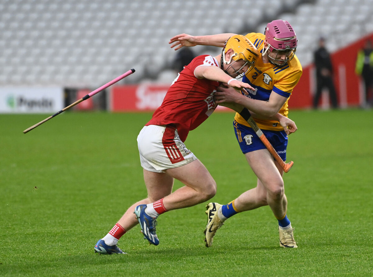 Cork's Ross O'Sullivan and Clare's John Cahill tussle for the sliotar. Picture: Eddie O'Hare