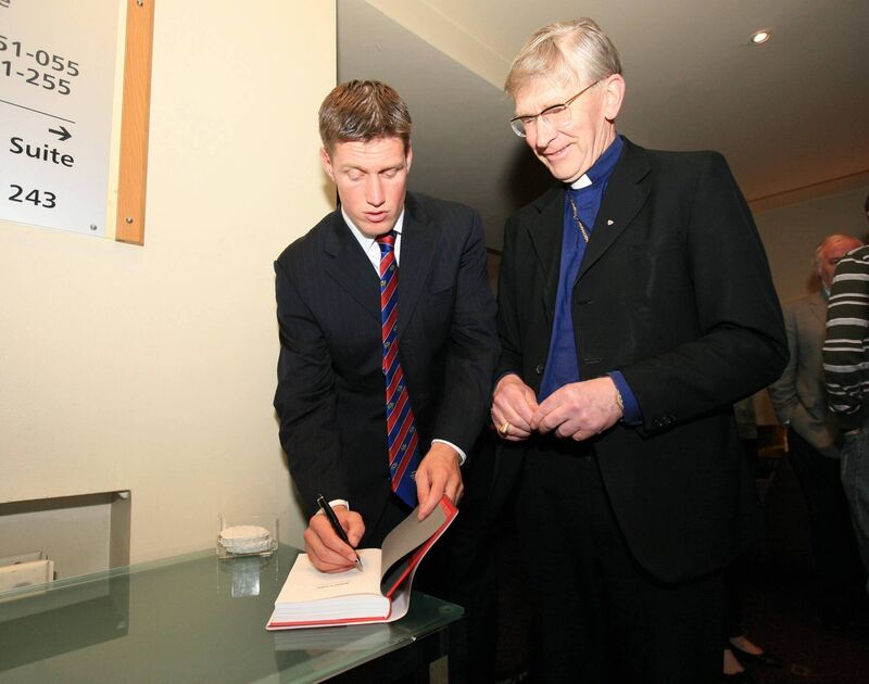 Ronan O'Gara signs a copy of his autobiography for Bishop John Buckley at the book's launch in the Maryborough Hotel, Douglas in 2008. Photo: Darragh Kane Ronan O'Gara signs a copy of his autobiography for Bishop John Buckley at the book's launch in the Maryborough Hotel, Douglas in 2008. Photo: Darragh Kane