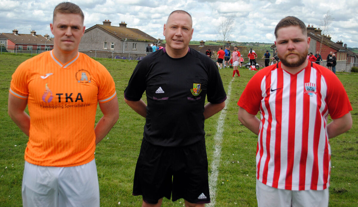 Cathedral Celtic's Johnnie O'Sullivan (left) with Castleview's Dylan Cambridge, accompanied by referee Alan McDonnagh.