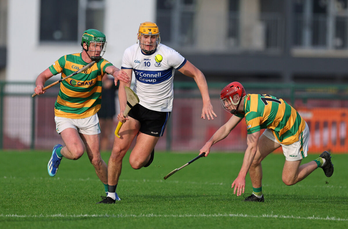 David O'Farrell and Ryan Sweeney, Blackrock, battle with Luke Elliott, Sarsfields. David O'Farrell and Ryan Sweeney, Blackrock, battle with Luke Elliott, Sarsfields.