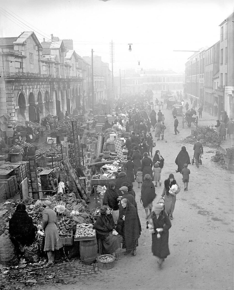 A busy shopping scene at Cornmarket Street in Cork city’s Coal Quay in 1936. Readers recall nights of fun at The Social Bar here - actually called Portrays - in the 1960s and ’70s - and women supped there too.
