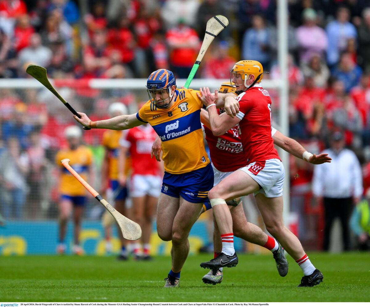 Cork's Shane Barrett tackles David Fitzgerald of Clare. Picture: Ray McManus/Sportsfile