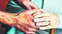 Home caregiver showing support for elderly patient.