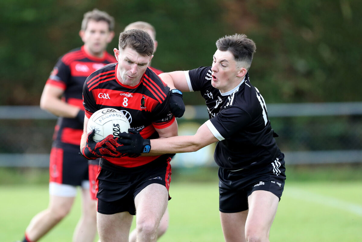 Newmarket's Mikey Cotterill in action against Maurice Casey of Kiskeam last year. Picture: Jim Coughlan Newmarket's Mikey Cotterill in action against Maurice Casey of Kiskeam last year. Picture: Jim Coughlan