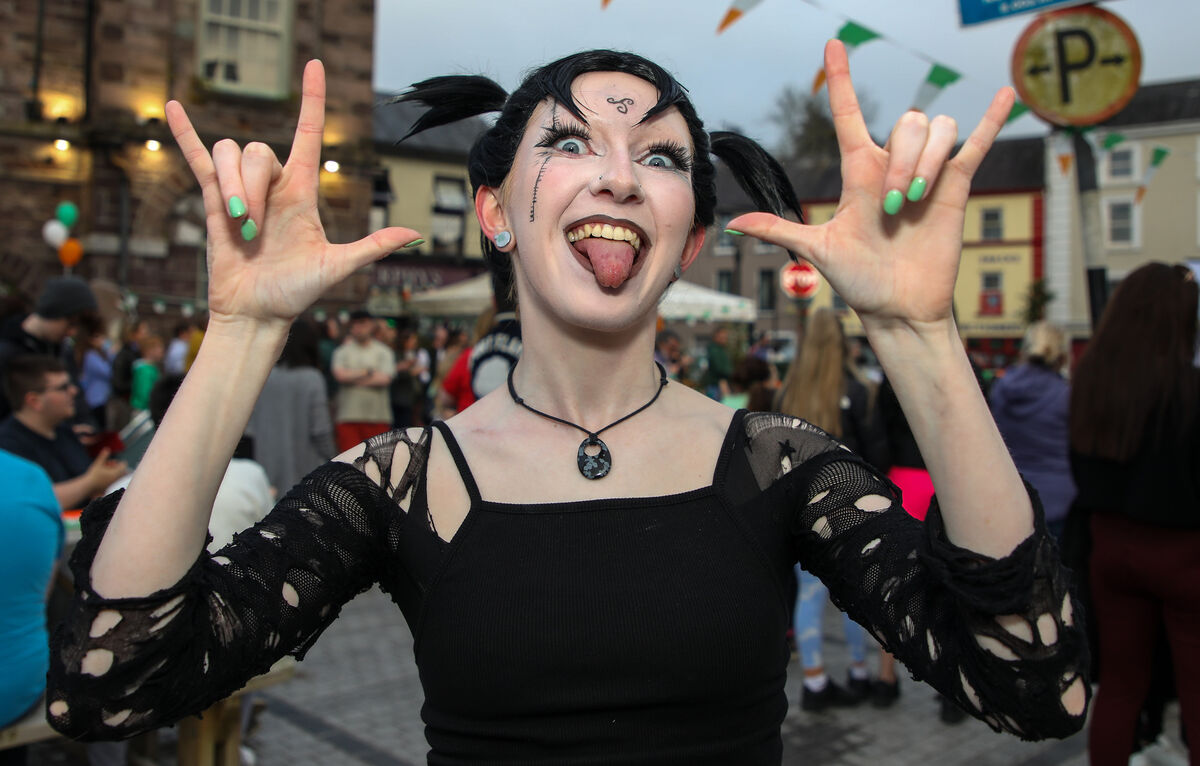 Aoife O'Connell makes the 'I Love You' in sign language to Bambi Thug at the Eurovision Watch Party that was held in the town square, Macroom, Co. Cork. - Picture: David Creedon