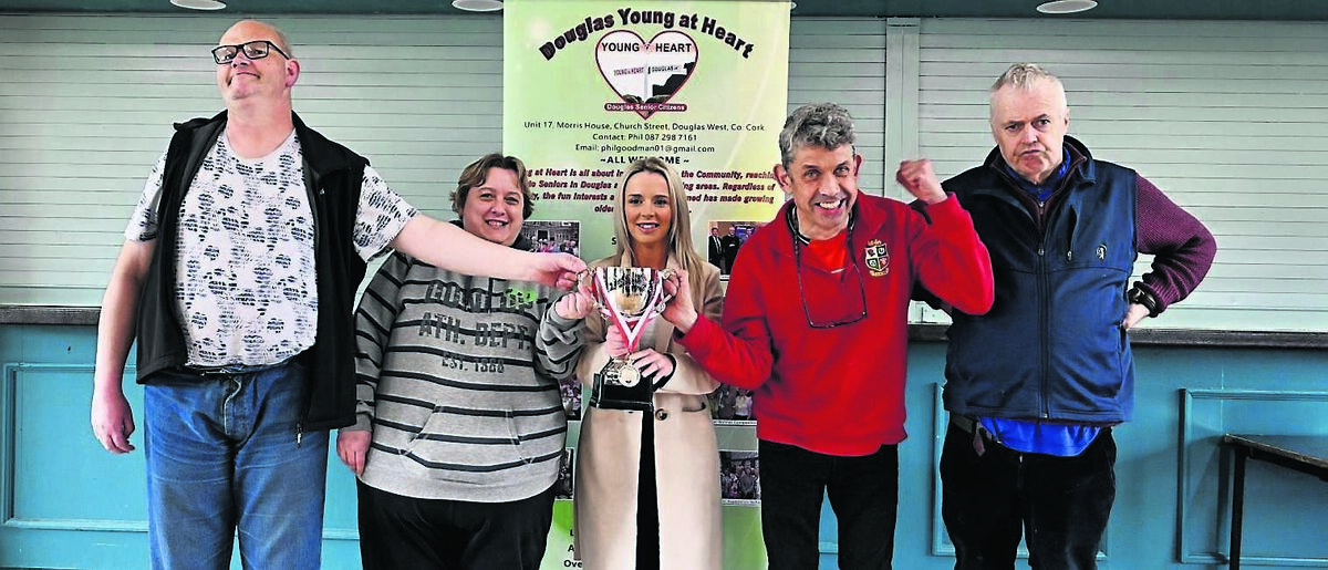 Roger Curtin, Caroline Orr, Gerard Mackesey and Dermot O’Sullivan from COPE Foundation pictured being presented with the trophy for first place by Rebecca O’Shea from SuperValu at the annual Young at Heart kurling competition in the Douglas GAA club hall on Wednesday. Picture Chani Anderson