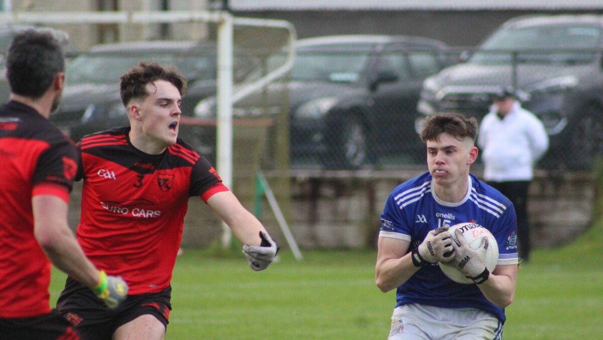 Naomh Abán's Ed Myers tries to move away from Barra Horgan of Béal Átha'n Ghaorthaidh. Picture: Orla Shorten