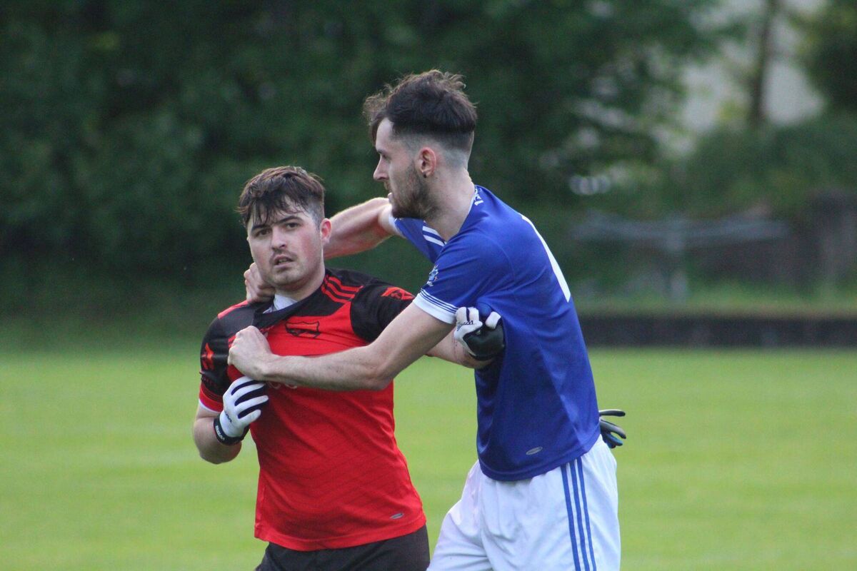 Béal Átha'n Ghaorthaidh's Daire O'Callaghan and Naomh Abán's Conor Creedon come together. Picture: Orla Shorten