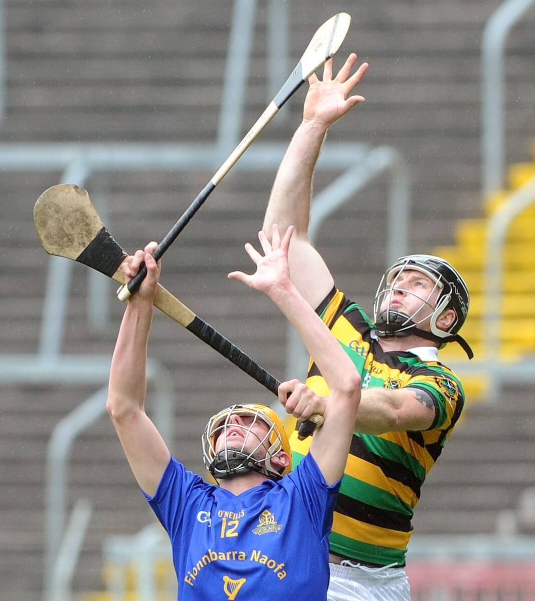 Graham Callanan going high for the ball with St. Finbarr's forward Eoin Maher at Páirc Úi Chaoimh. Picture: Denis Minihane.