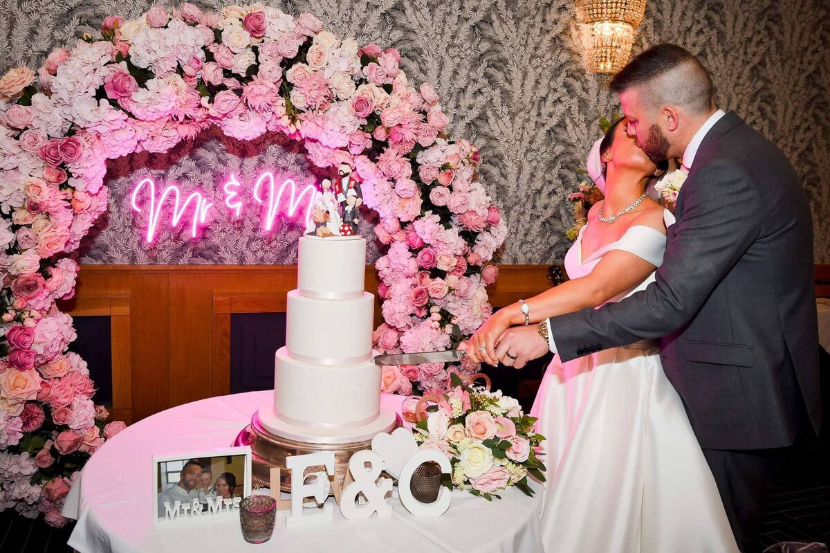 The cake was by The Baker Boy. The topper, with a sports theme, was by Belle cake toppers.