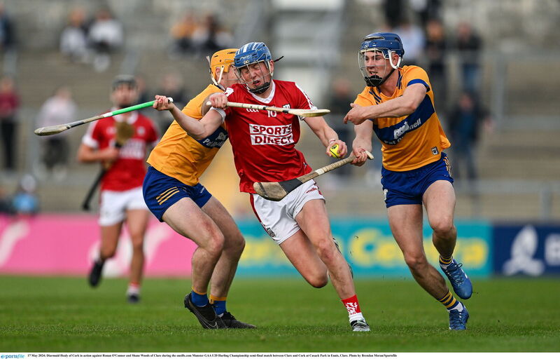Cork's Diarmuid Healy tries to get past Clare duo Ronan O'Connor and Shane Woods in Friday's oneills.com Munster U20HC semi-final at Cusack Park. Picture: Brendan Moran/Sportsfile