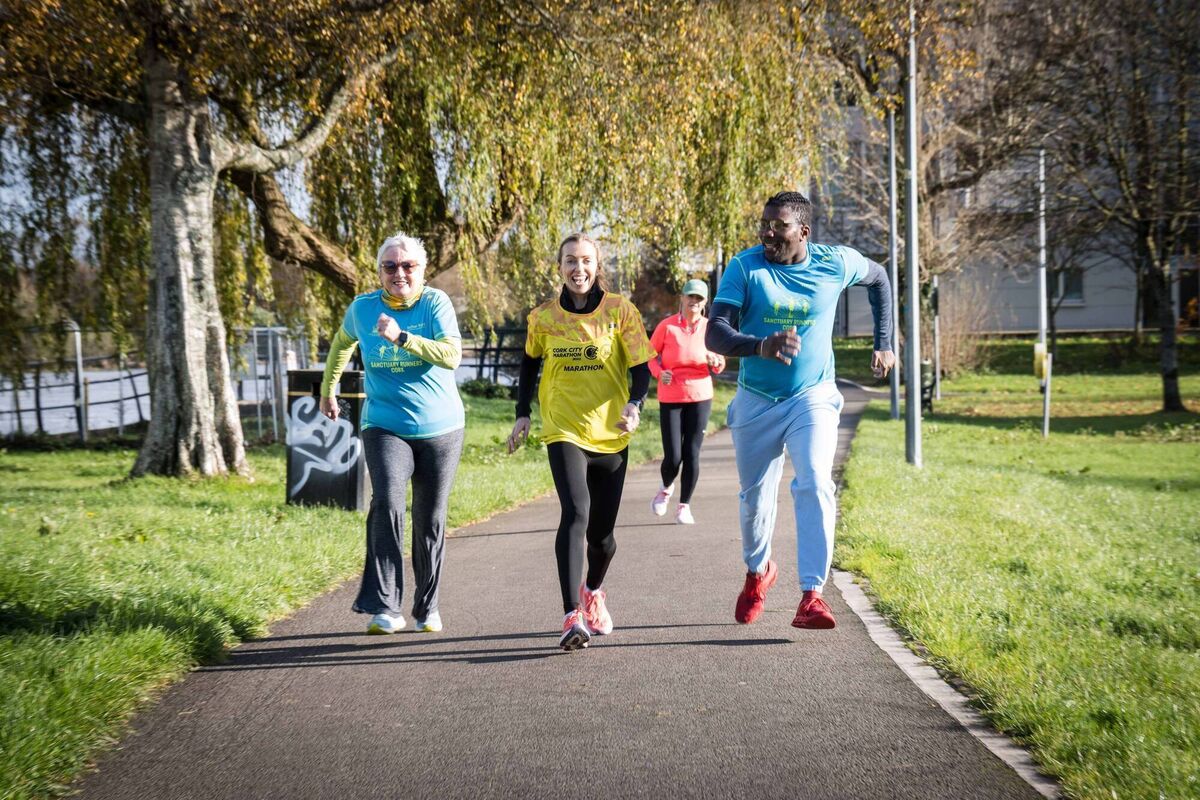 Sanctuary Runners Siun Kearney and Esmeraldo Taveres with Irish olympic athlete Lizzie Lee at the launch of the Cork City Marathon, which will take place on Sunday 2 June 2024. Photo Joleen Cronin. Sanctuary Runners Siun Kearney and Esmeraldo Taveres with Irish olympic athlete Lizzie Lee at the launch of the Cork City Marathon, which will take place on Sunday 2 June 2024. Photo Joleen Cronin.