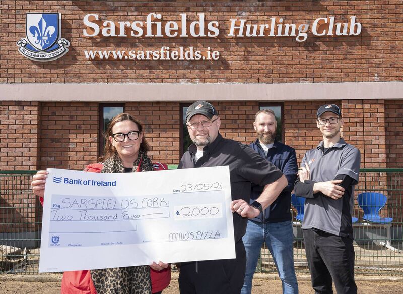 Pictured at Sarsfields GAA club are Sarah McCarthy PRO ,Harry Ormond Secretary Sarsfield GAA club with Cathal McDonnell and Jacopo Garavaglia from Domino's Pizza Glanmire, raising a slice of pizza in celebration of the opening of the new Domino’s store in Glanmire. Photo credit: By Gerard McCarthy. Pictured at Sarsfields GAA club are Sarah McCarthy PRO ,Harry Ormond Secretary Sarsfield GAA club with Cathal McDonnell and Jacopo Garavaglia from Domino's Pizza Glanmire, raising a slice of pizza in celebration of the opening of the new Domino’s store in Glanmire. Photo credit: By Gerard McCarthy.
