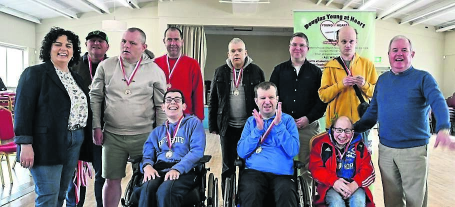 Cllr Mary Rose and Cllr Terry Shannon with the kurling teams from the Brook Centre and Praxis Care at the competition.
