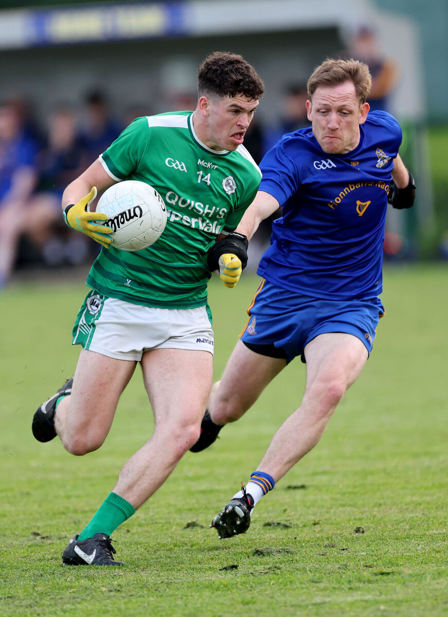  Sam Ryan, St. Finbarrs, battles with Darragh O'Mahony, Ballincollig.