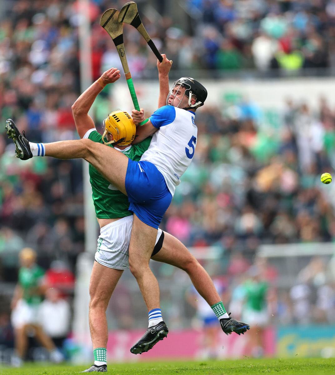 Cathal O'Neill of Limerick and Waterford's Mark Fitzgerald battle for possession. Picture: Inpho/James Crombie