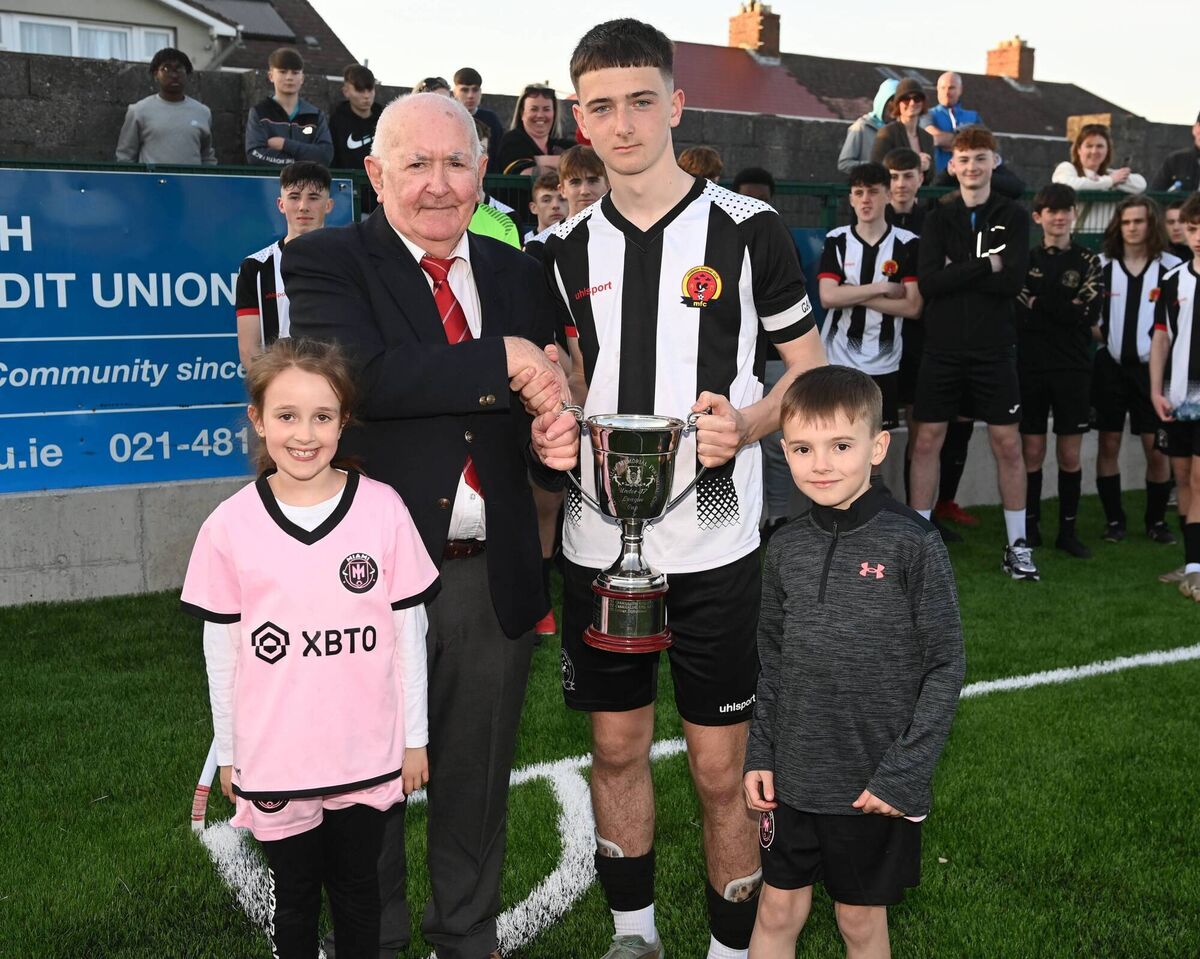 Peadar O'Leary presents the Gussie Walsh trophy to Midleton captain and Player of the Match Dylan Lyons, with Ruairi Power and Aoibhe Walsh, Gussie Walsh's grandchildren after defeating Lakewood Athletic. Picture: Eddie O'Hare