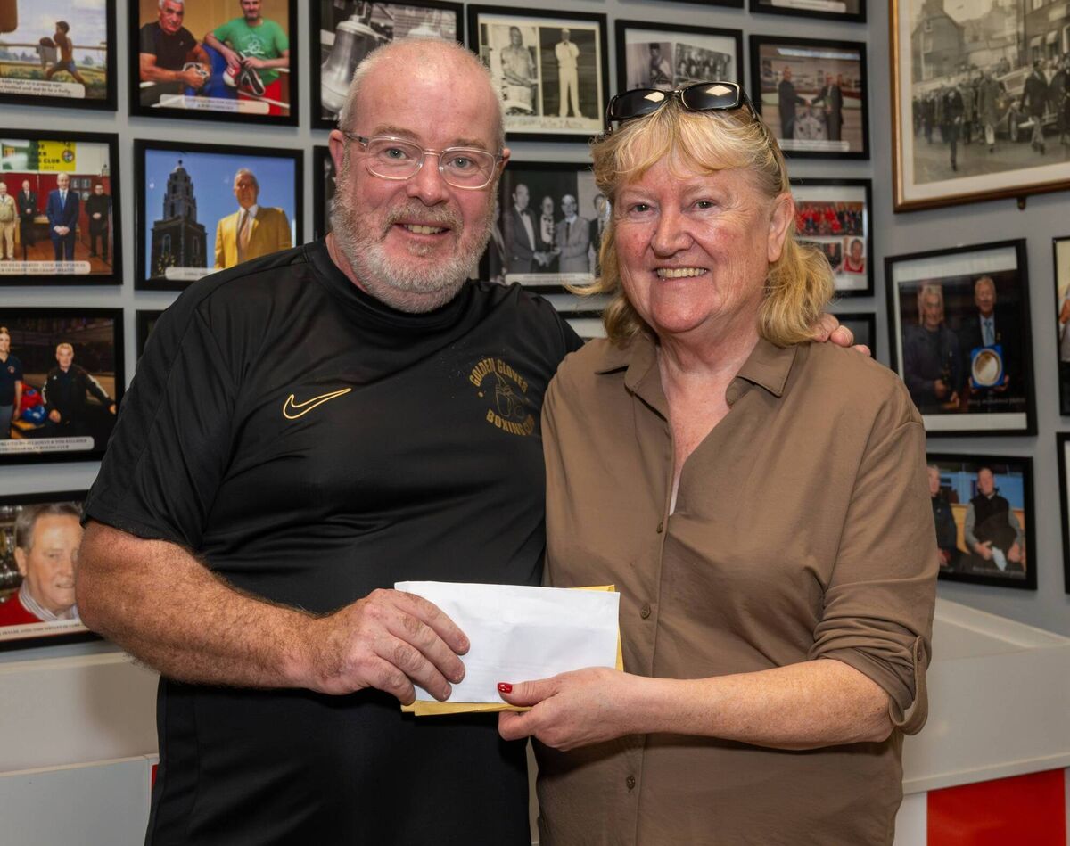 Cork Boxing: John Morrissey of Golden Gloves BC presenting Caitríona Twomey of Cork Penny Dinners with the proceeds of the very successful Senior tournament organised by Morrissey at the Northside Boxing Club. Picture: Doug Minihane