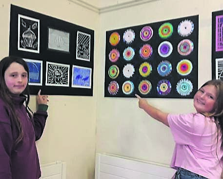 Pearl (12) and Cidhna (11) check out ‘Let’s Call it Picasso’, an exhibition of artwork in Mayfield Library by Third Year students at St. Patrick’s College, Gardiner’s Hill.