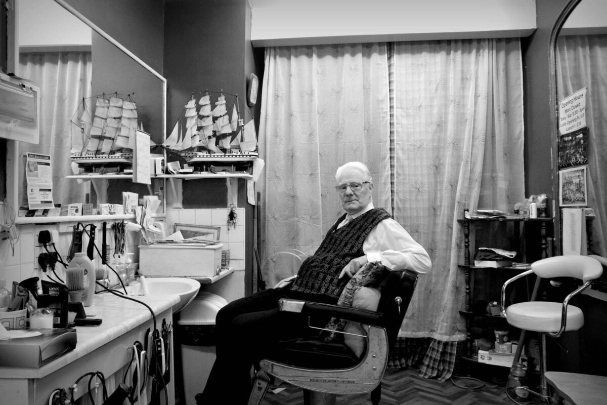 This photograph shows Tommy Cragoe."In 1959, at 18 years of age, he opened his barber shop on Harbour Row. It became the longest running business in the hands of one person, until it closed in 2022," Mr Mackessy said. This photograph shows Tommy Cragoe."In 1959, at 18 years of age, he opened his barber shop on Harbour Row. It became the longest running business in the hands of one person, until it closed in 2022," Mr Mackessy said.