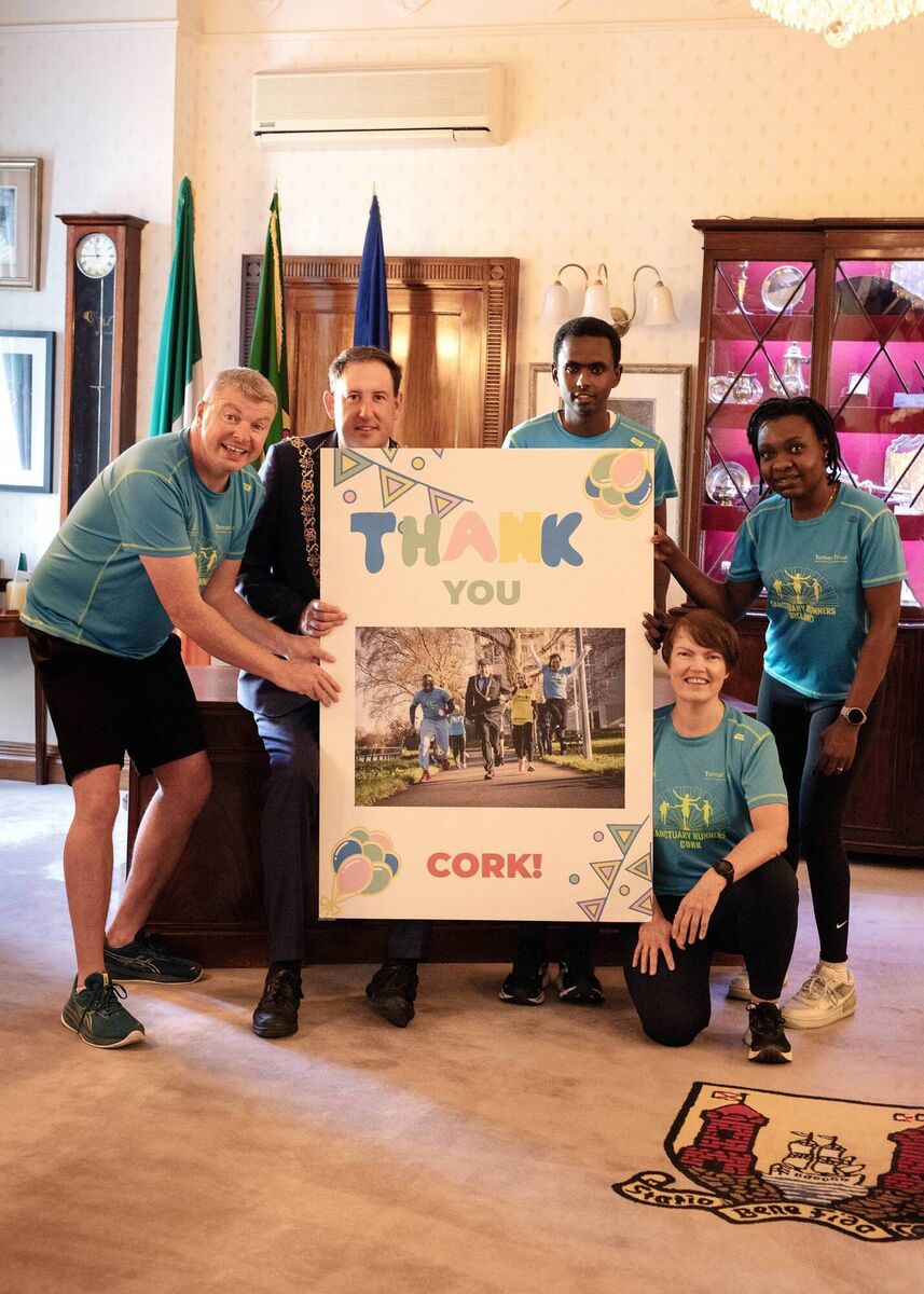 Graham Clifford, founder of Sanctuary Runners; Lord Mayor of Cork Kieran McCarthy; Abdikadir Ibrahim; Annemarie Sheehan; and Sibusisiwe Mhlophe as Sanctuary Runners thanked the Independent councillor for his support leading up to the Cork City Marathon. Photo credit: Alicja Sweeney.