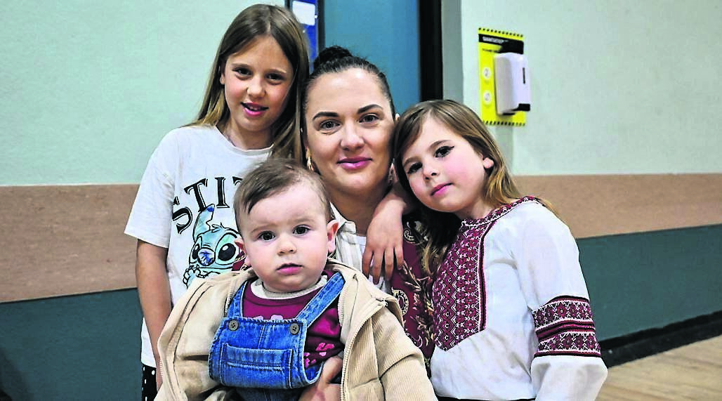 Alisa Tkalenko with her children, Emilia, David, and Elizabeth, at Mahon Community Centre.