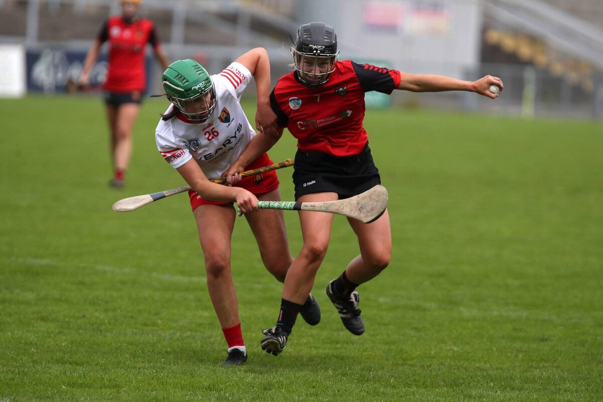 Cork's Cliona Healy challeges Down's Rhea Smyth during their Glen Dimplex All-Ireland camogie championship clash at Páirc Esler, Newry. Cork's Cliona Healy challeges Down's Rhea Smyth during their Glen Dimplex All-Ireland camogie championship clash at Páirc Esler, Newry.