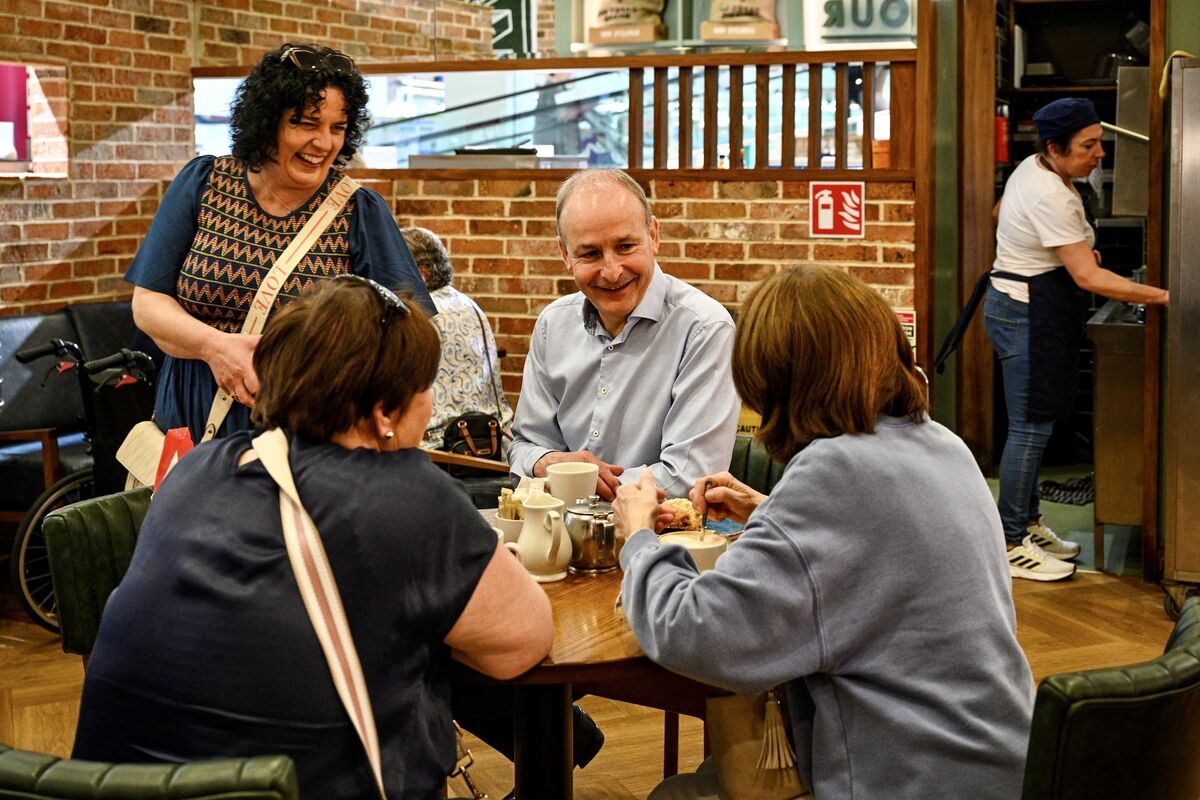 Mary Rose Desmond and Tánaiste Micheál Martin pictured speaking with Susan Murphy and Grace Brophy in the Douglas Village shopping centre where they canvassed together on Saturday. Picture: Chani Anderson