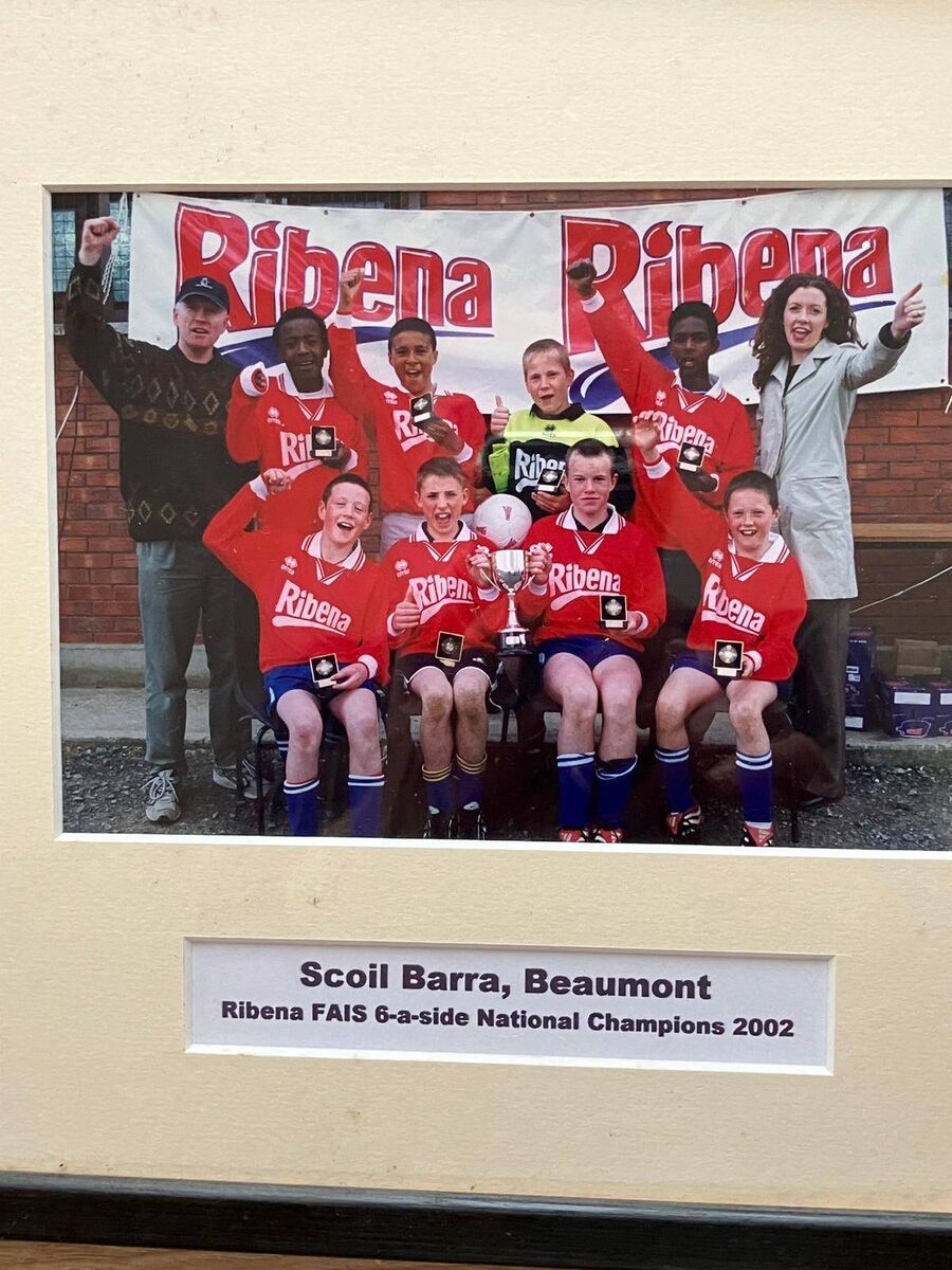 The Beaumont NS 2002 team picture hanging on the wall in the school.