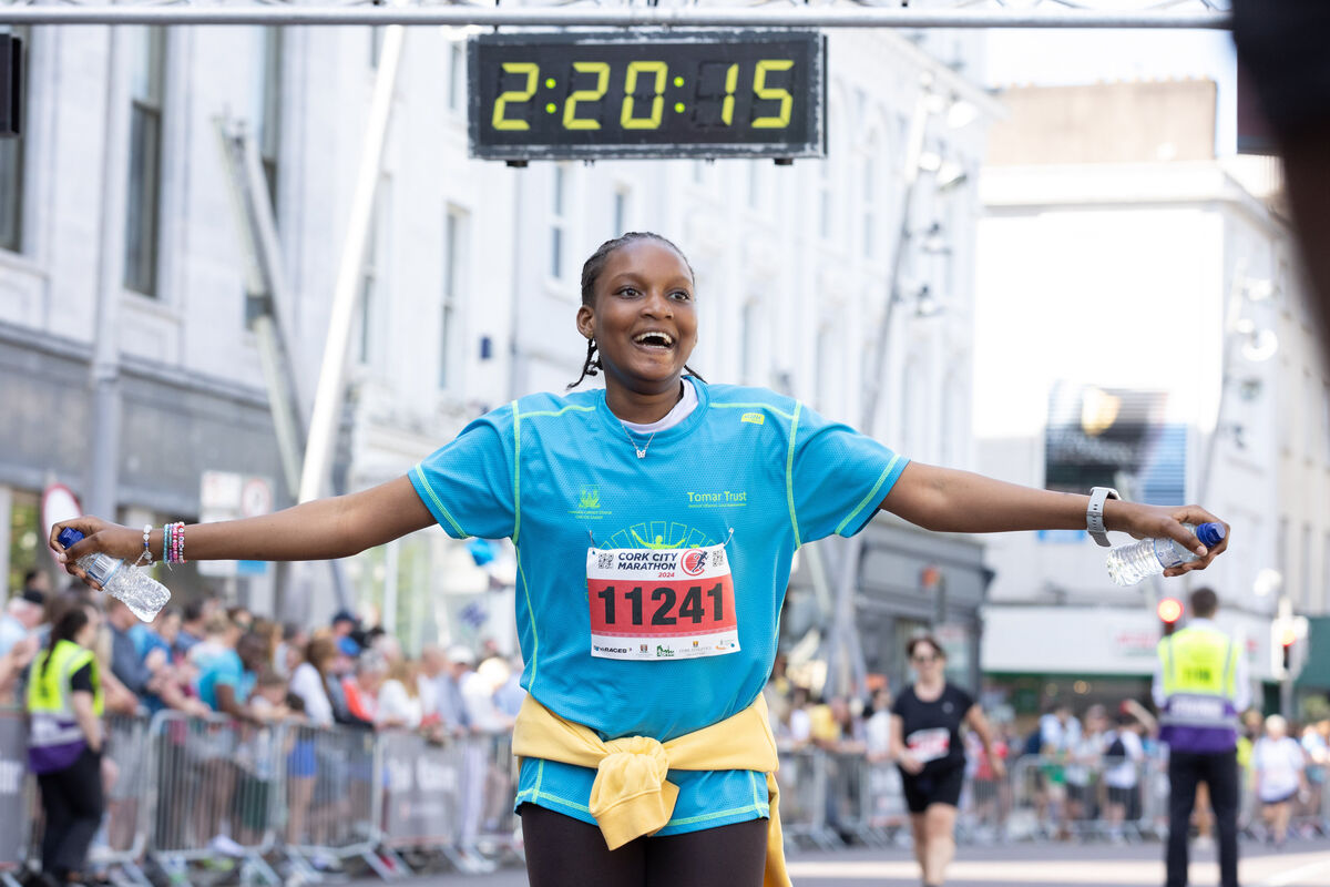 Rejoice Oludoyin crossing the finish line of the 10K at the Cork City Marathon. 