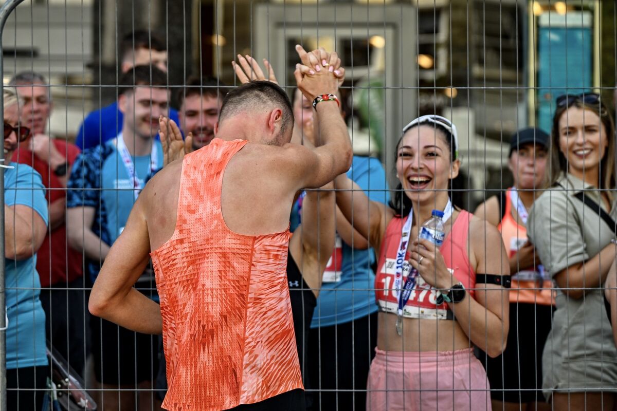 Vera Kosek congratulates her husband, Pawel, two time winner of the Cork City Marathon as he crosses the line with an incredible time of 2:23:54. Picture: Chani Anderson