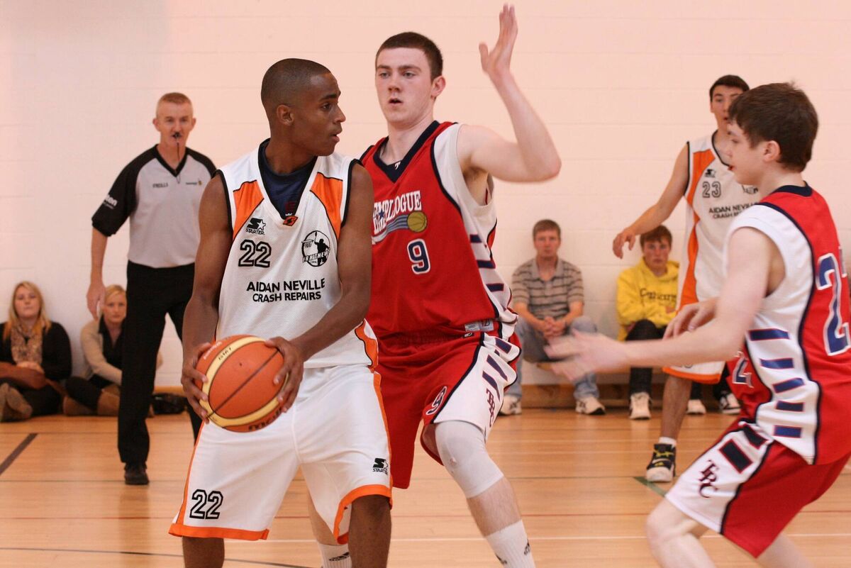 Fr Mathew's point guard Erbie Underwood (# 22) looks for a way through the Templeogue defence in their U18 National Cup game in Galway.