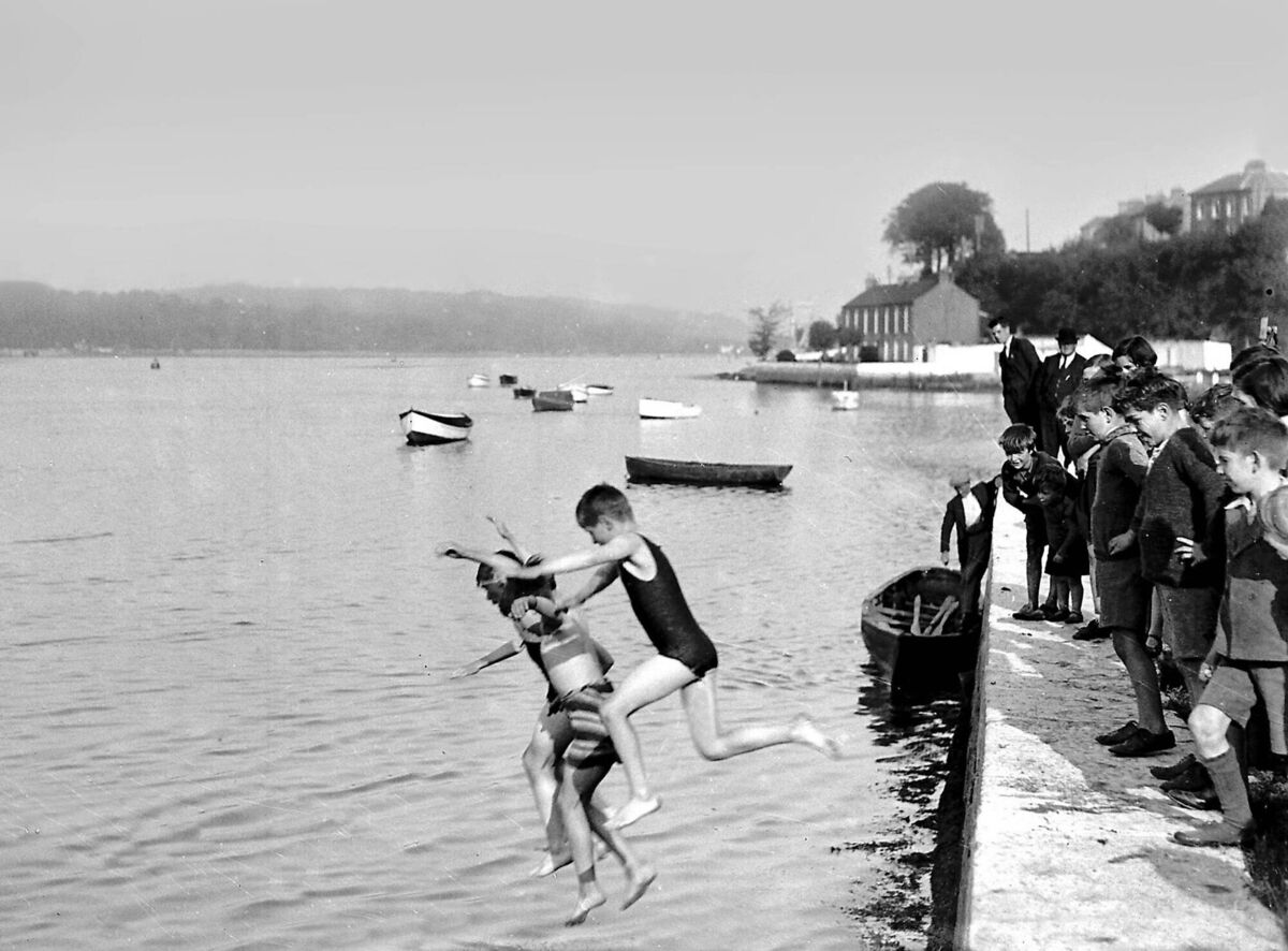 Children swimming from the pier at Blackrock on September 17, 1936. A reader recalls swimming in the Sawmills almost every day as a child, and at White Bay on weekends