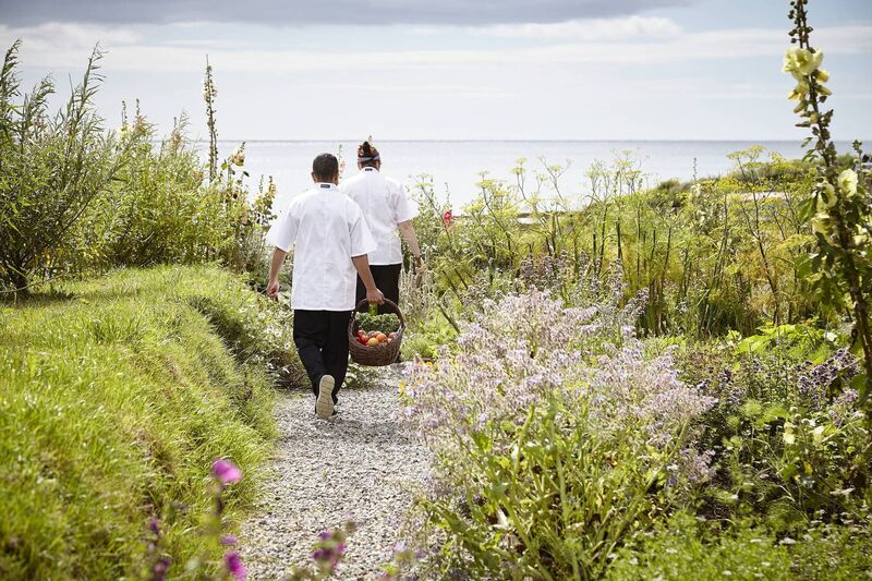 Staff walking to The Ocean Garden, the hotel's very own organic kitchen.