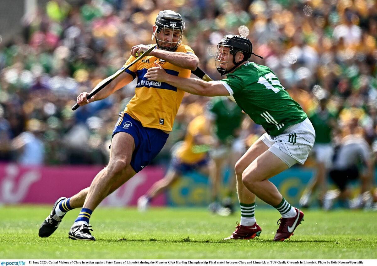 Cathal Malone of Clare in action against Peter Casey of Limerick last year. Picture: Eóin Noonan/Sportsfile