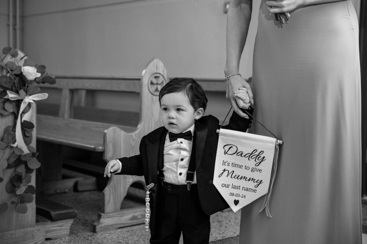 Lucas walking up the aisle as his mum Claire Palmer and dad Nicolas Panagiodis were married.