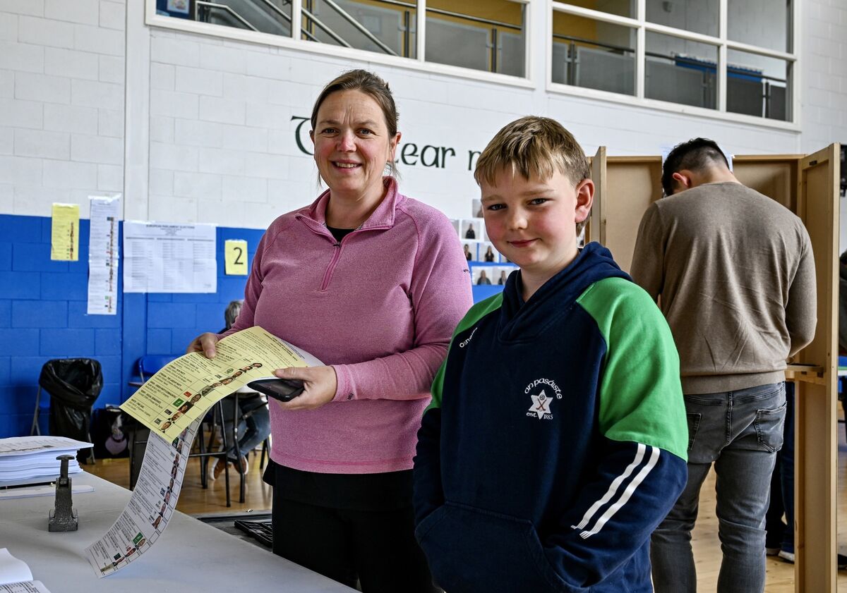 Grace Leonard casts her vote in Friday’s elections while her son Darragh Kenny (9) offers moral support. Picture Chani Anderson Grace Leonard casts her vote in Friday’s elections while her son Darragh Kenny (9) offers moral support. Picture Chani Anderson